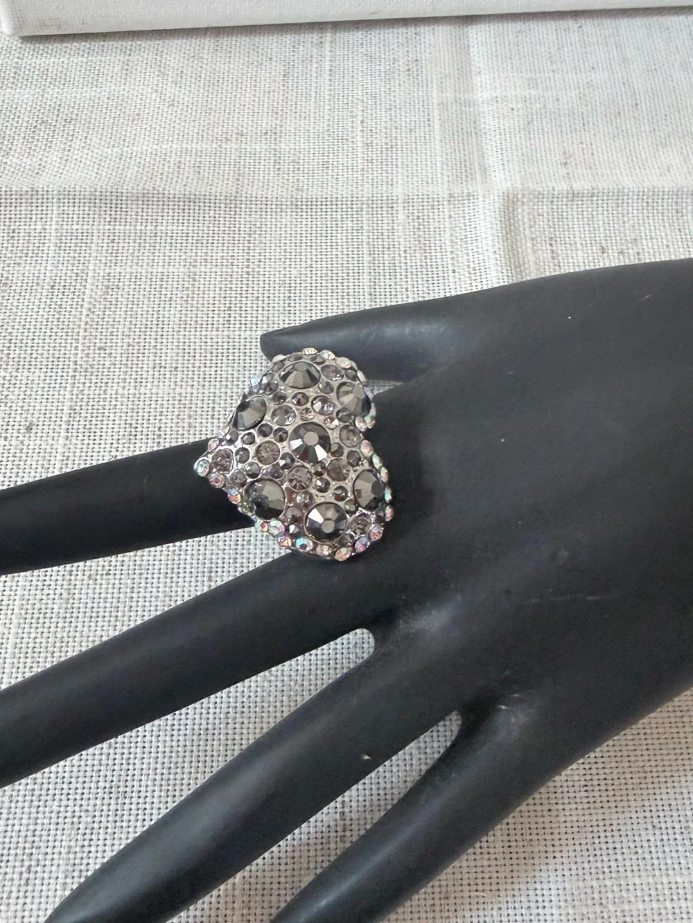 silver-tone puffy heart cocktail ring encrusted with an assortment of rhinestone